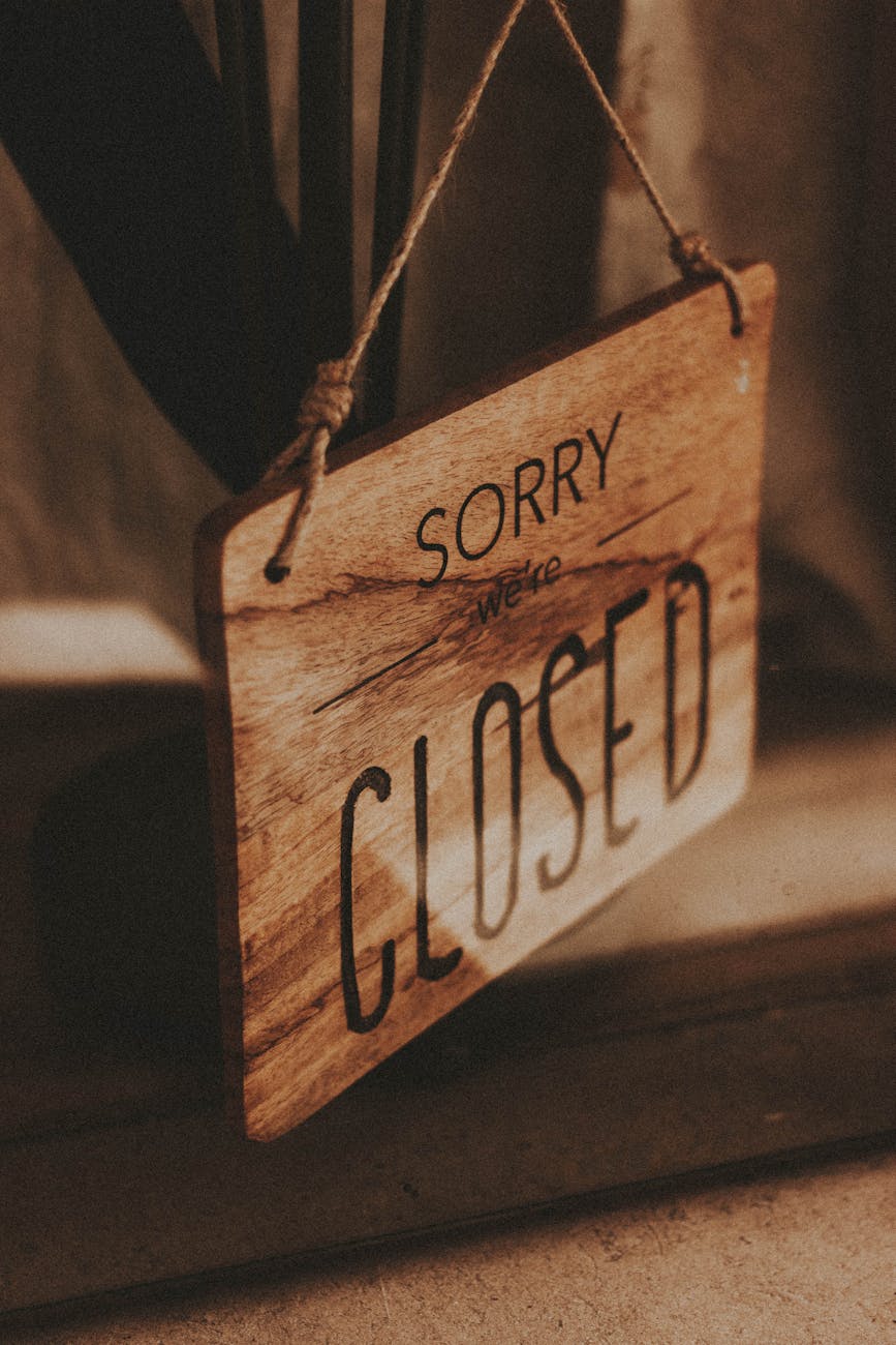 sorry closed wooden board at entrance